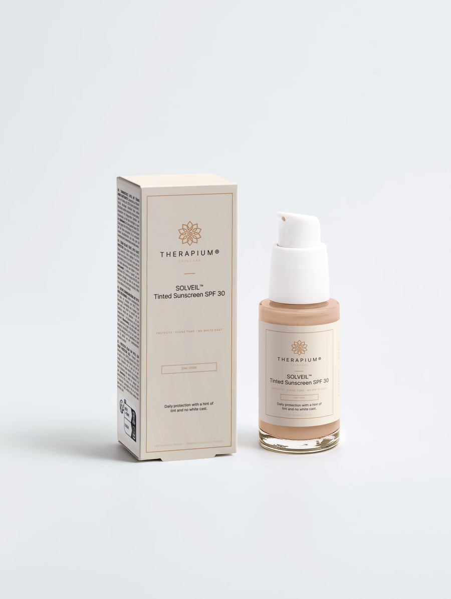 Therapium SOLVEIL™ Tinted Sunscreen SPF 30 pump bottle next to its carton, front view on a plain studio background