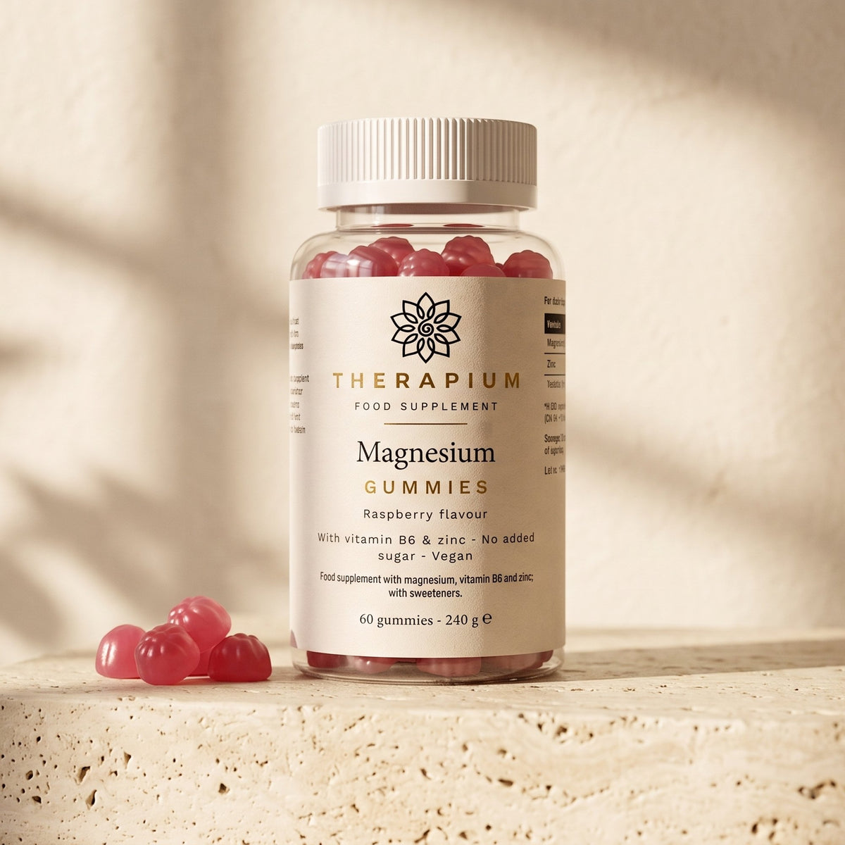 Therapium Magnesium Gummies jar on a travertine stone ledge in warm morning light