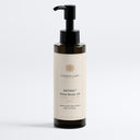 Therapium SATINA Glow Body Oil with seven plant oils, omega 6 and 9, 150 ml amber pump bottle with cream label, front view on a plain studio background