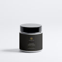 Therapium LUMINARIS™ Heather soy wax candle in a clear glass vessel, upright against a plain studio background