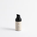 Therapium VIRIS™ 3-in-1 Eye Cream, airless pump bottle with a black cap, front view on a plain studio background
