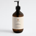 Therapium BALNEA™ Hand & Body Wash — Peppermint & Dark Cedar, 490 ml amber pump bottle, front label, on a plain studio background