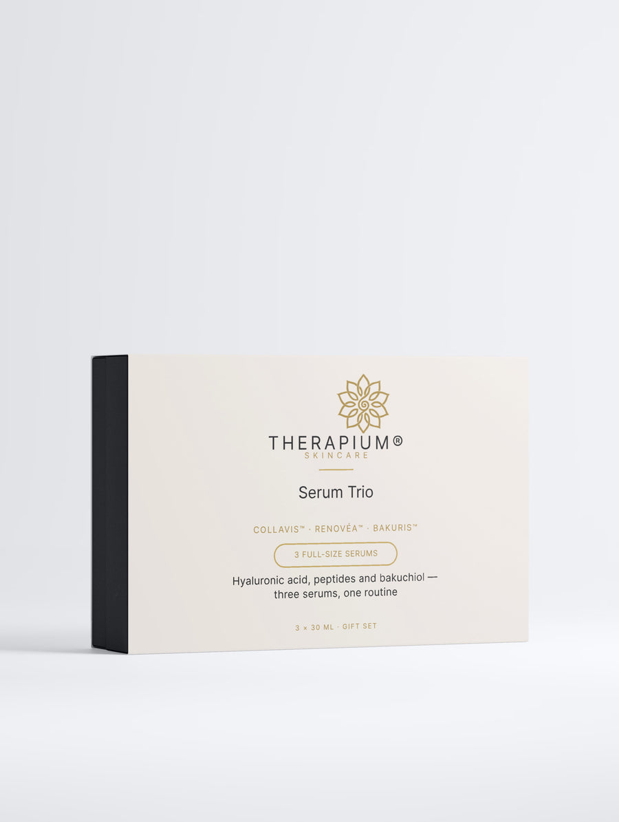 Therapium Serum Trio gift box, front of the printed sleeve on a plain studio background