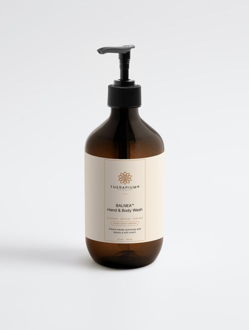Therapium BALNEA™ Hand & Body Wash — Ginger & Smoky Cardamom, 490 ml amber pump bottle, front label, on a plain studio background