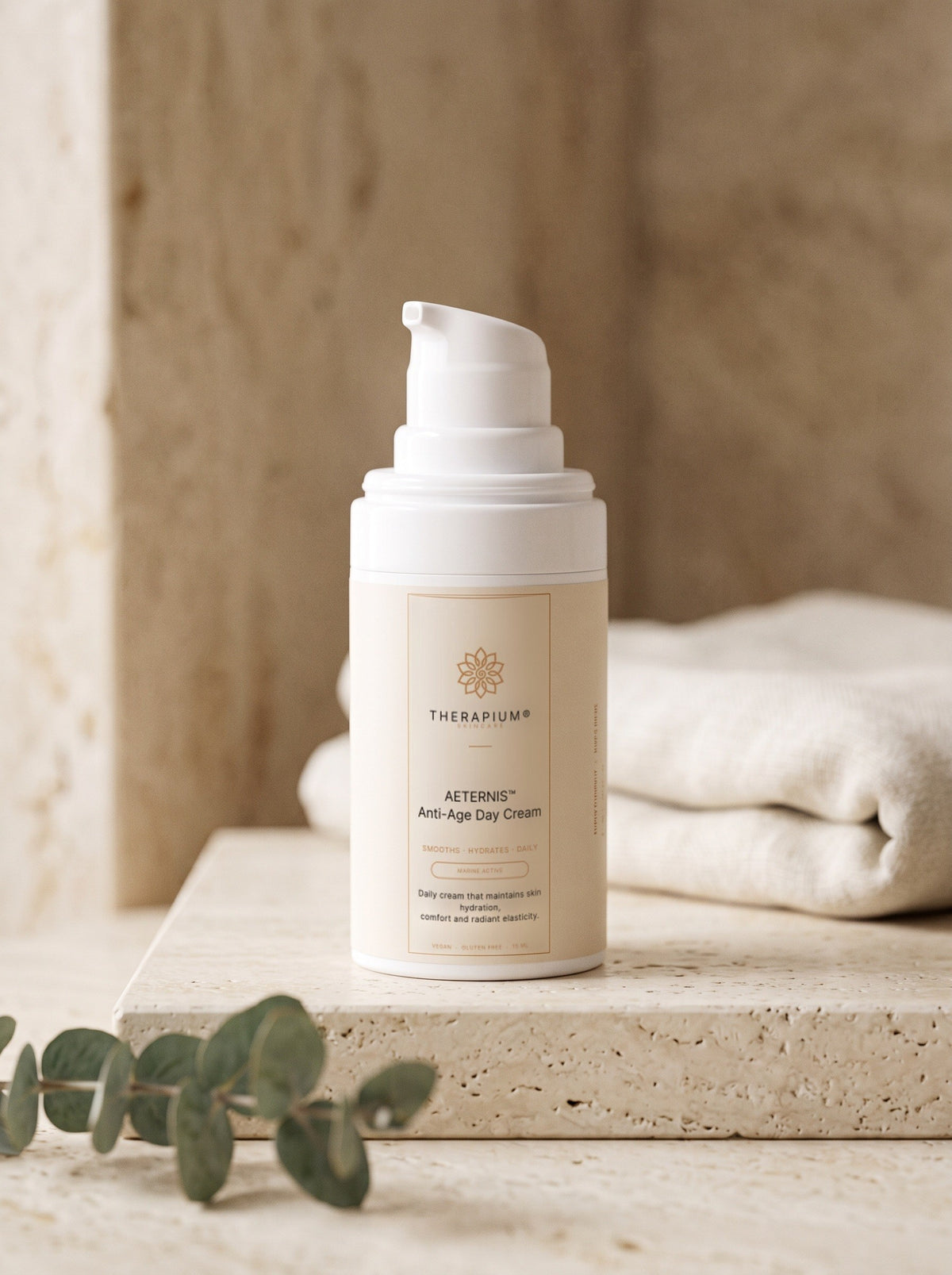 Therapium AETERNIS Anti-Age Day Cream pump bottle on a travertine shelf in morning light