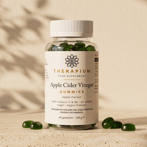 Therapium Apple Cider Vinegar Gummies jar on a travertine stone ledge in warm morning light