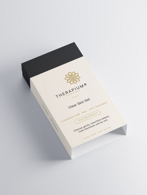 Therapium Clear Skin Set gift box shown at an angle, black base and printed sleeve
