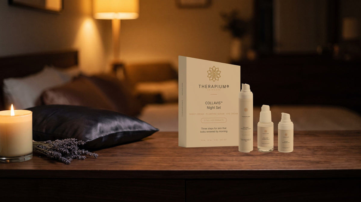 Therapium COLLAVIS Night Set box with night cream, plumping serum and eye cream on a walnut bedside vanity by candlelight