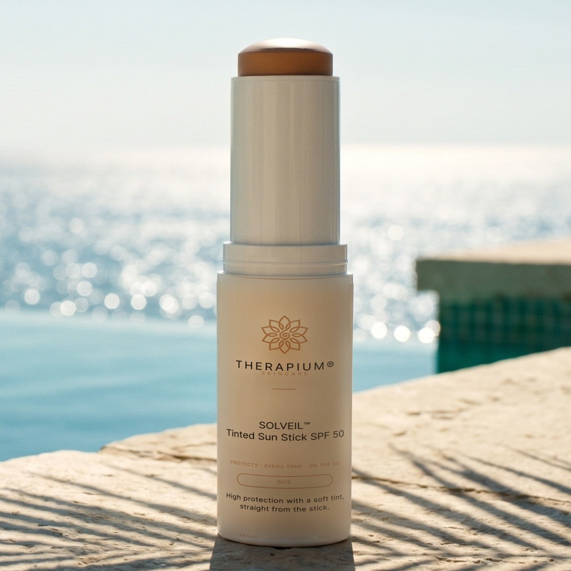 Therapium SOLVEIL™ Tinted Sun Stick SPF 50, styled scene