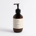 Therapium UREVA Rough Skin Body Cream with 5% urea, 280 ml amber pump bottle with cream label, front view on a plain studio background