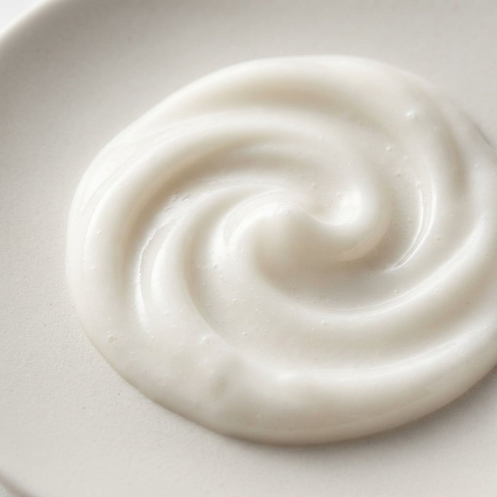 Macro of the creamy milky texture of the Therapium cleansing milk