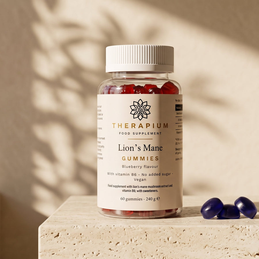 Therapium Lion's Mane Gummies, the jar on a travertine ledge in morning light with three blueberry gummies beside it