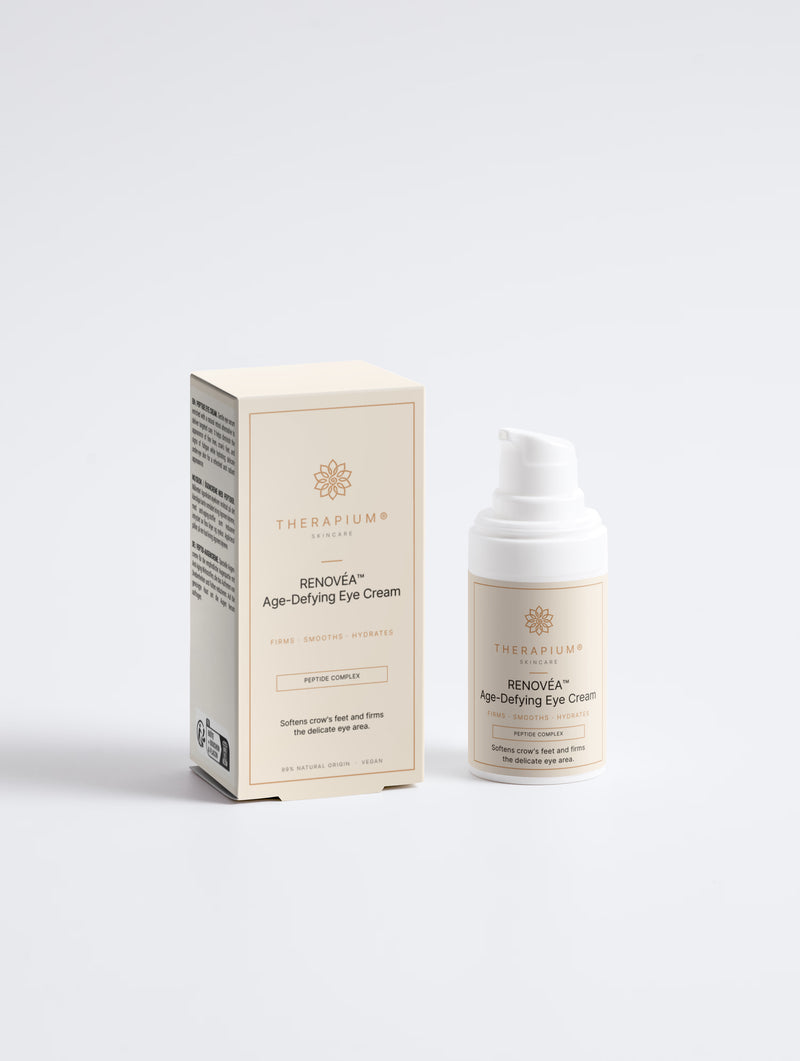 Therapium RENOVÉA™ Age-Defying Eye Cream, 15 ml airless pump bottle next to its carton, front view on a plain studio background